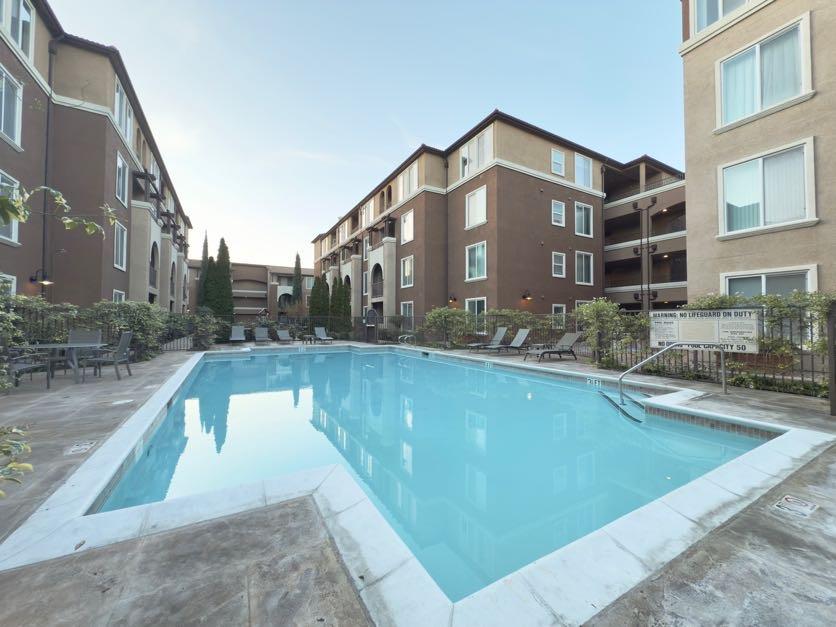 801 South Winchester Boulevard, Unit 4310 San Jose, CA 95128 - Photo 27 of 38 a front view of a house with swimming pool