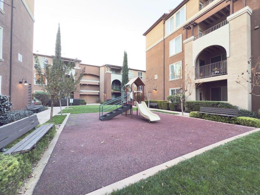 801 South Winchester Boulevard, Unit 4310 San Jose, CA 95128 - Photo 29 of 38 a front view of a house with a yard