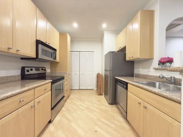 a kitchen with a stove and a microwave