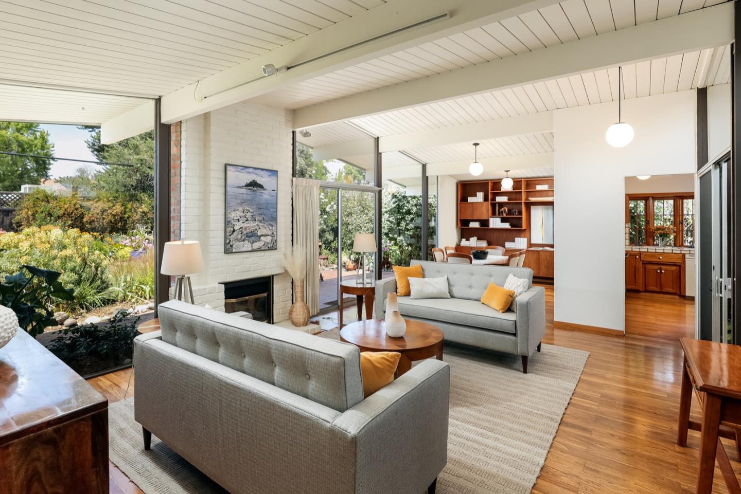 777 Devonshire Way Sunnyvale, CA 94087 - Photo 2 of 25 a living room with furniture and a fireplace