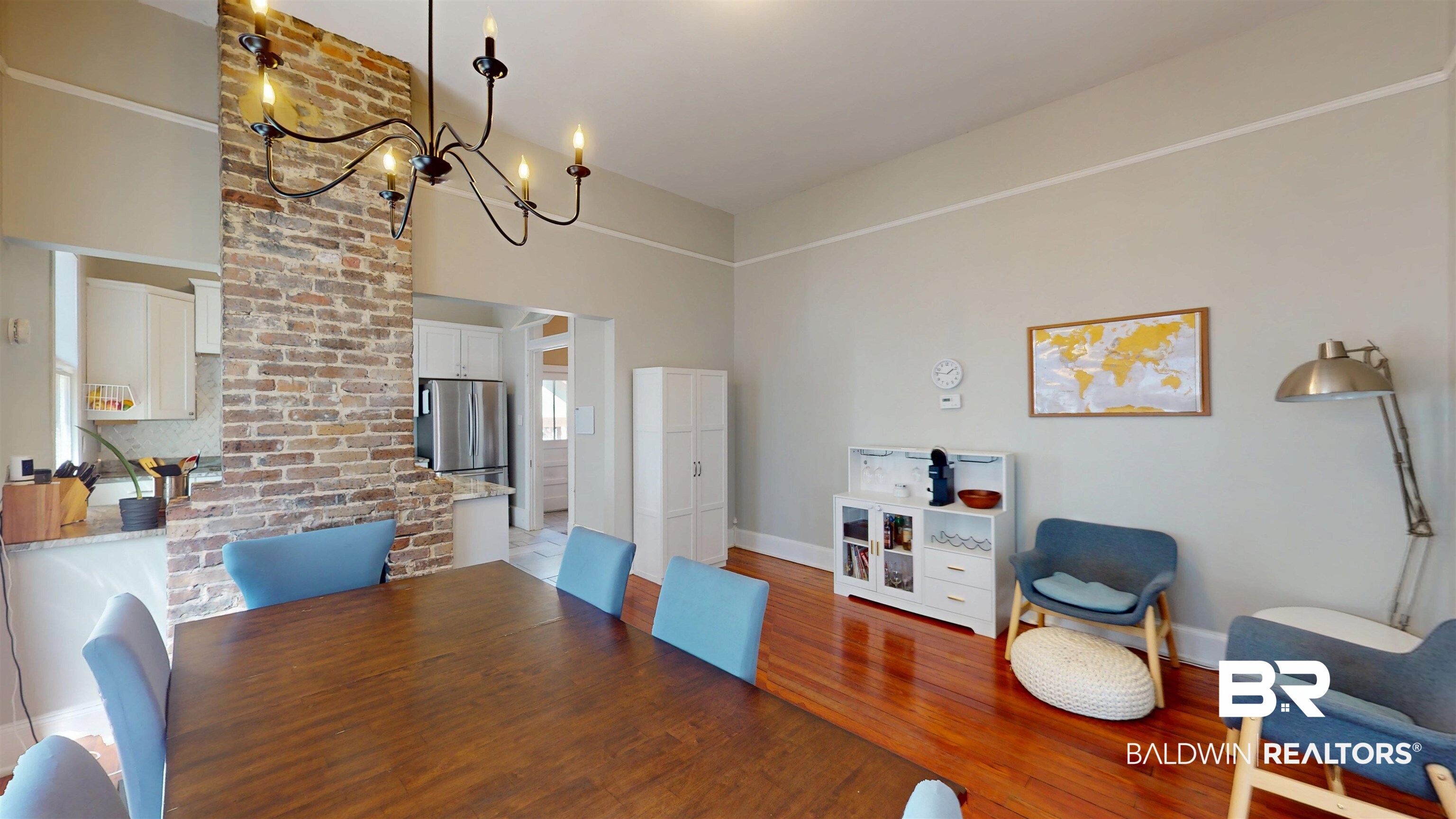 1154 New St Francis Street Mobile, AL 36604 - Photo 23 of 37 Dining room featuring wood finished floors, baseboards, and a chandelier