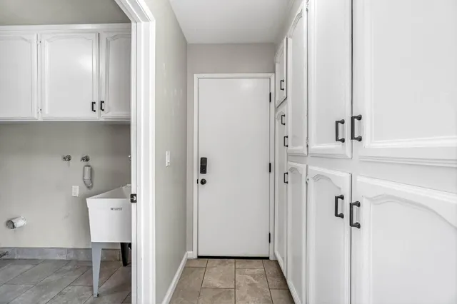 a view of a bathroom with a sink and mirror