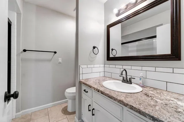 a bathroom with a glass shower door
