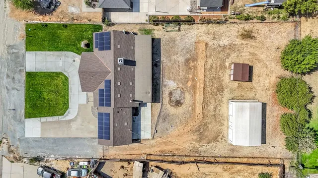 an aerial view of a house with a garden