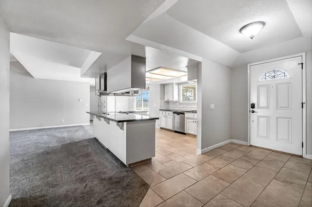 a room with a cabinets and kitchen view