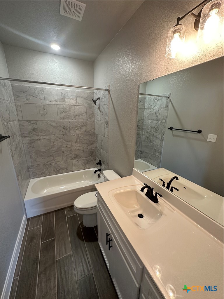 1423 Curlew Lane Temple, TX 76502 - Photo 12 of 16 a bathroom with a sink a toilet and shower