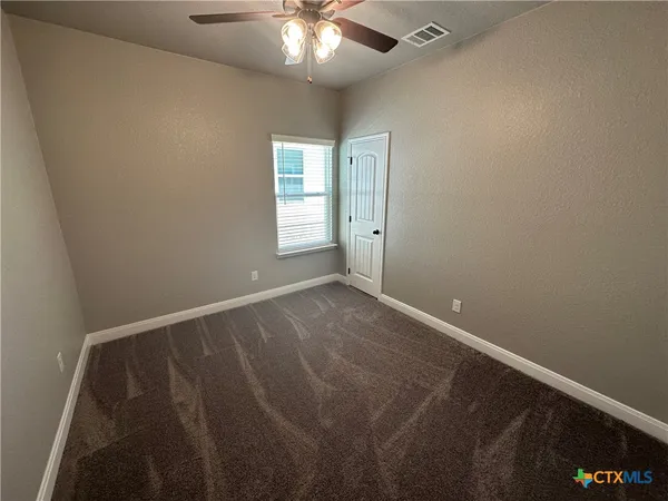 a view of a room with rack on the wall