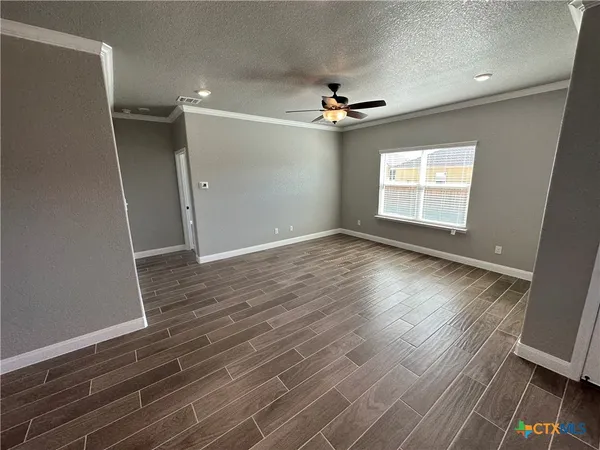 a view of an empty room with a window