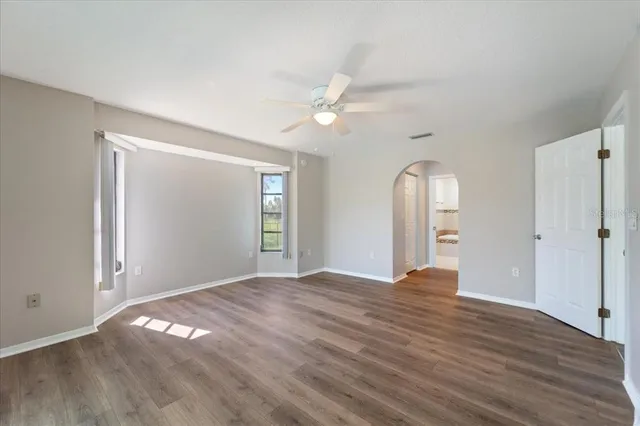 a bathroom with a tub a sink and mirror