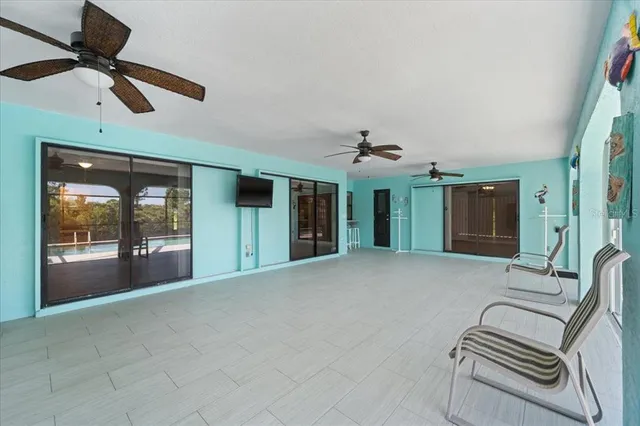 a view of room with furniture and flat screen tv