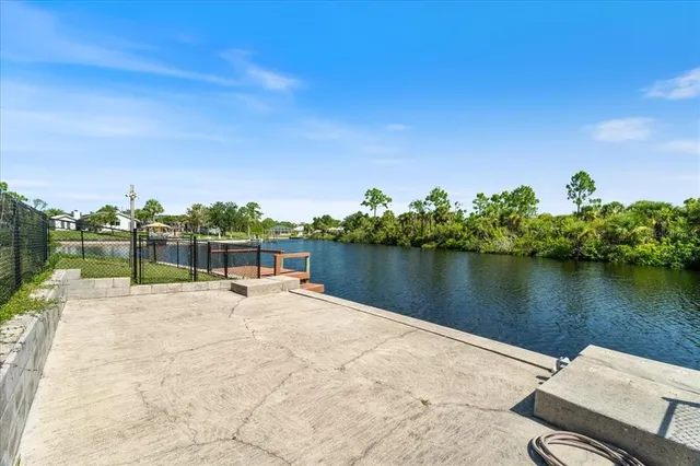 a terrace view with sitting space and lake view