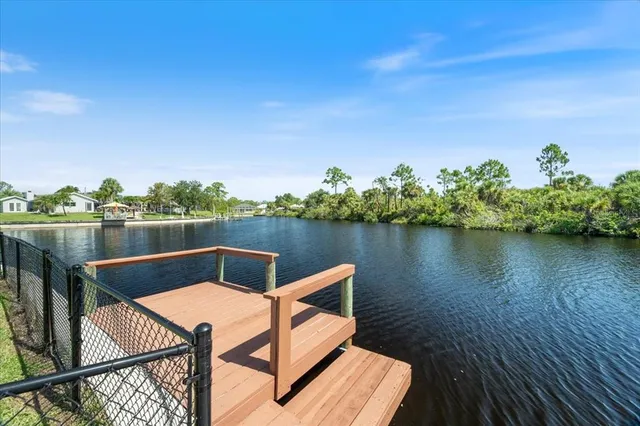 a view of swimming pool with outdoor seating