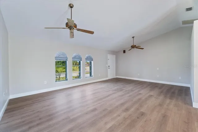 a view of an entryway with wooden floor