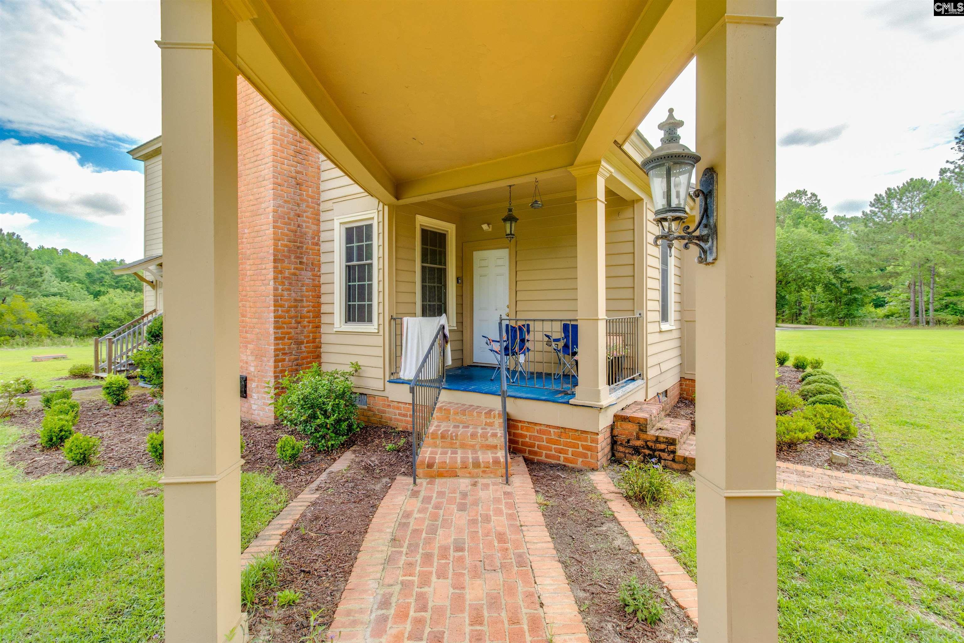 701 Longtown Road Columbia, SC 29229 - Photo 3 of 26 a view of a house with backyard and sitting area