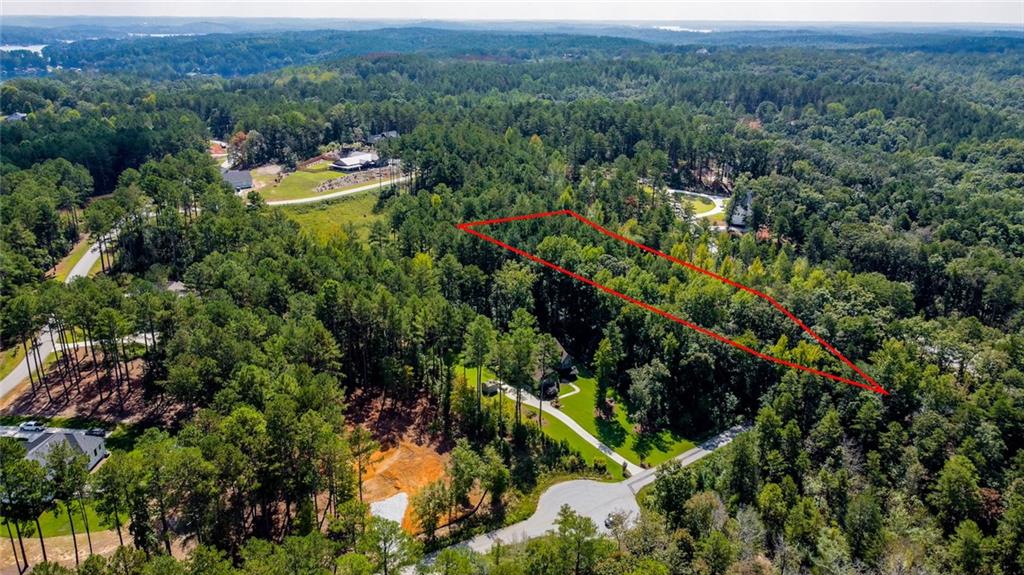 Lot 30 Harbor Point Seneca, SC 29672 - Photo 7 of 12 A verdant parcel outlined in red offers a prime building opportunity amidst mature woodlands.