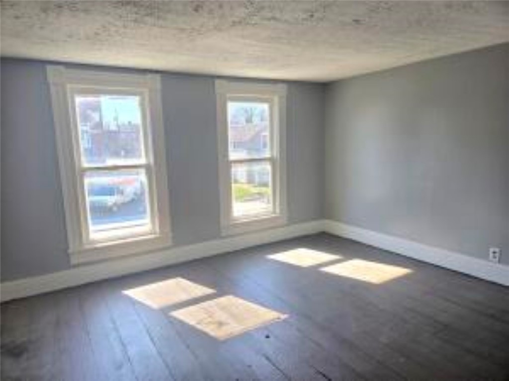 820 West North Street Springfield, OH 45504 - Photo 16 of 20 Sun-drenched room with wood flooring and classic window trim offers a serene retreat.