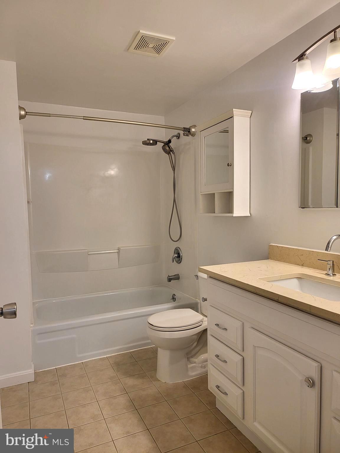 6556 Frietchie Row Columbia, MD 21045 - Photo 21 of 21 a bathroom with a granite countertop sink toilet and shower