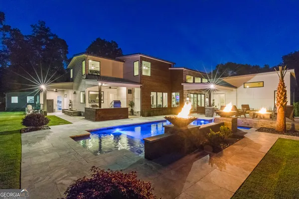 a view of a swimming pool with a house