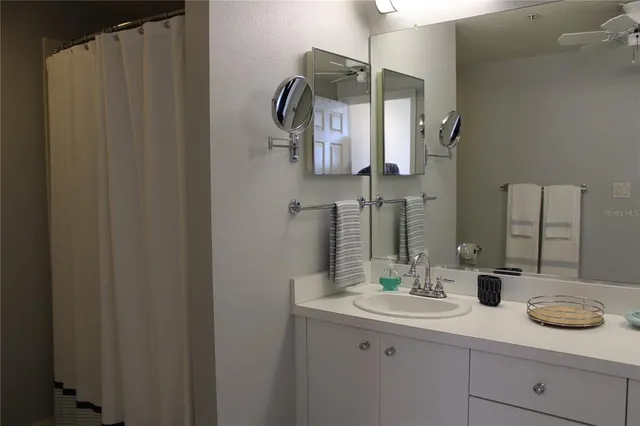 a bathroom with a double vanity sink and mirror