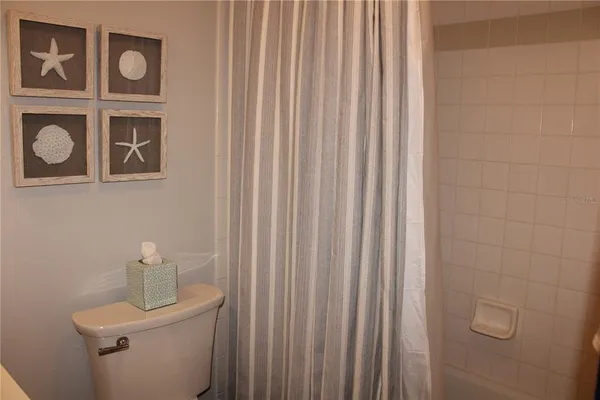 a bathroom with a toilet and a sink