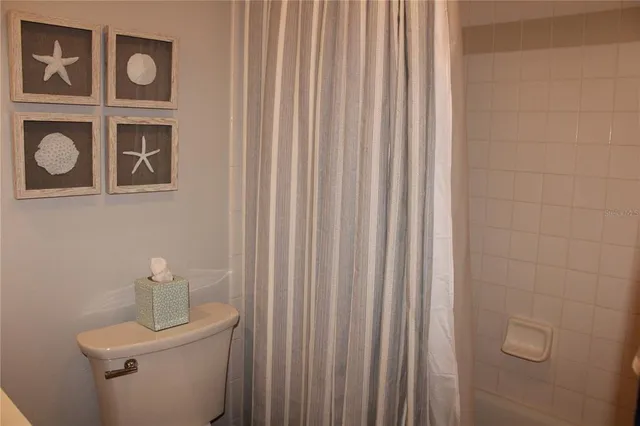 a bathroom with a toilet and a sink