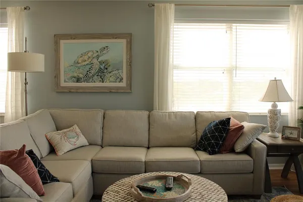 a living room with furniture and a large window