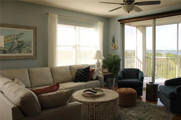 a living room with furniture and a large window