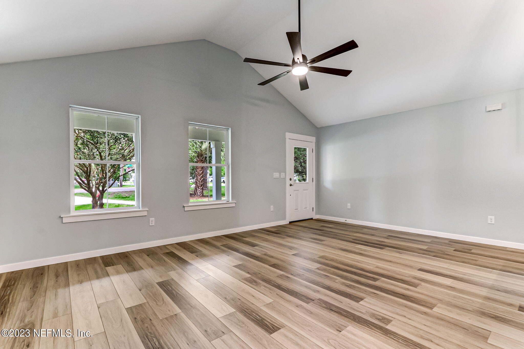 45115 South Mickler Street Callahan, FL 32011 - Photo 15 of 24 a view of an empty room with wooden floor and a window