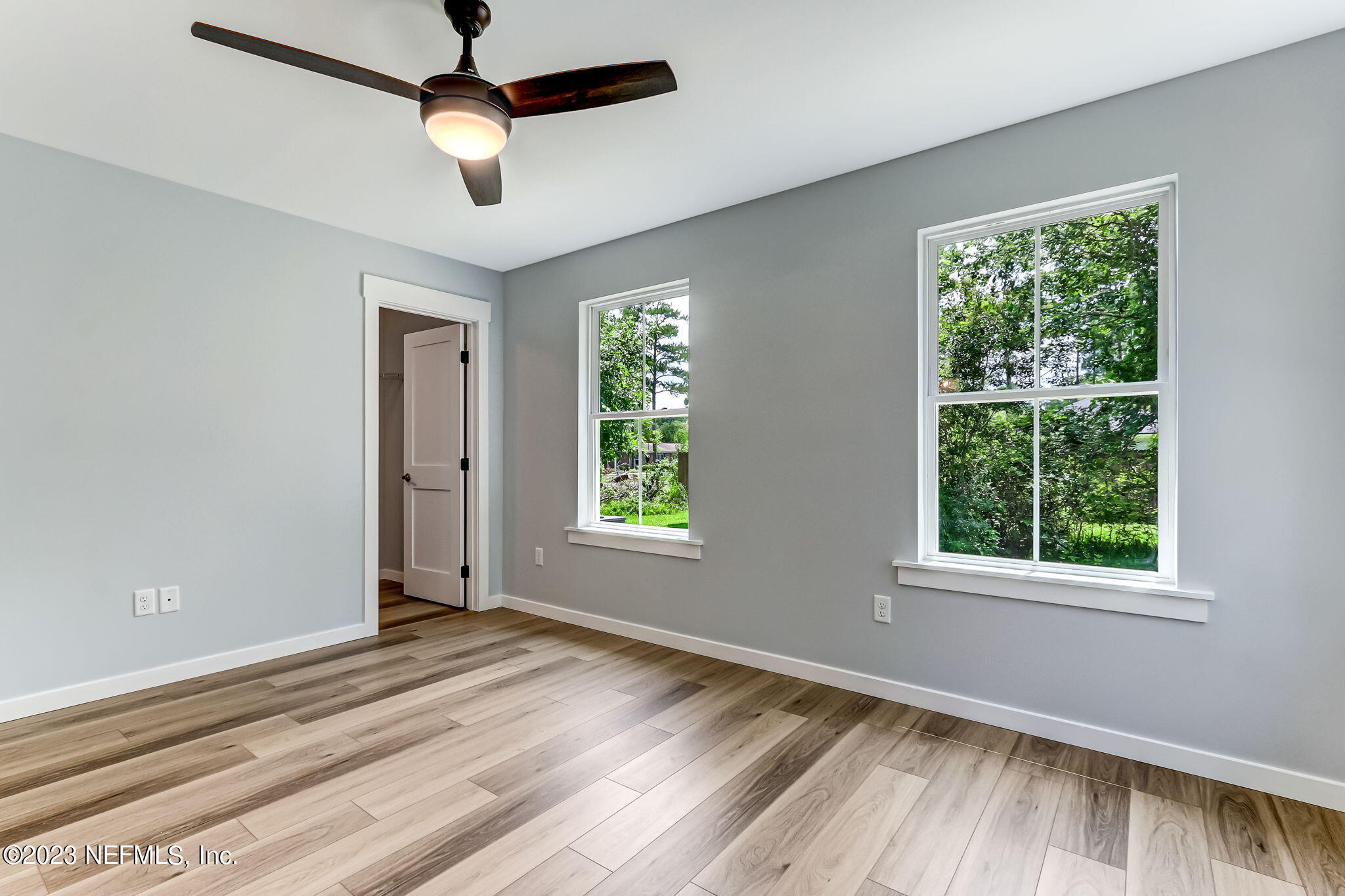 45115 South Mickler Street Callahan, FL 32011 - Photo 17 of 24 a view of empty room with wooden floor and fan