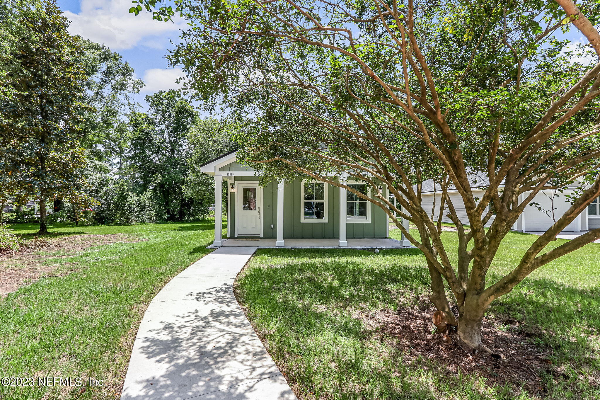 45115 South Mickler Street Callahan, FL 32011 - Photo 2 of 24 front view of a house with a yard