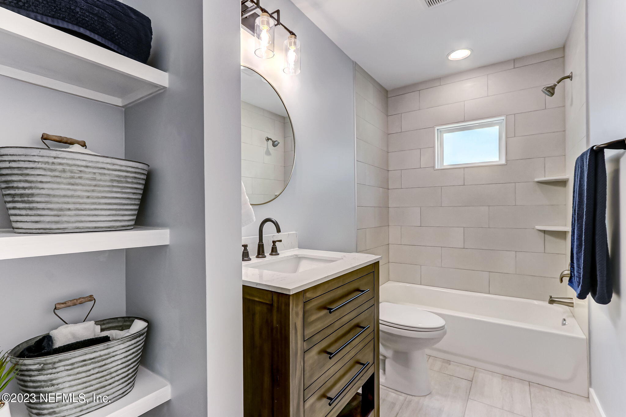 45115 South Mickler Street Callahan, FL 32011 - Photo 22 of 24 a bathroom with a sink toilet and shower