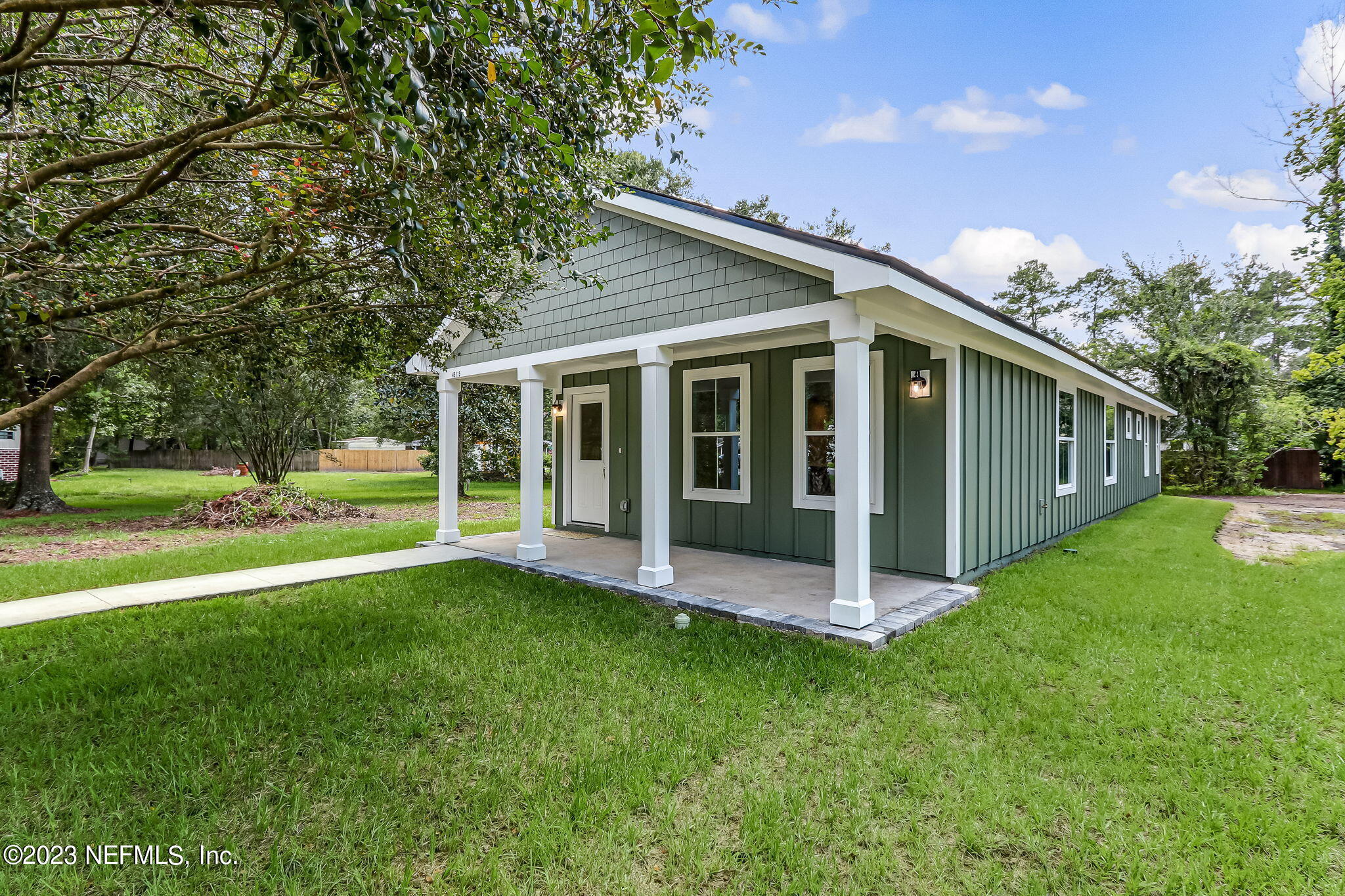45115 South Mickler Street Callahan, FL 32011 - Photo 5 of 24 a view of a house with backyard and porch