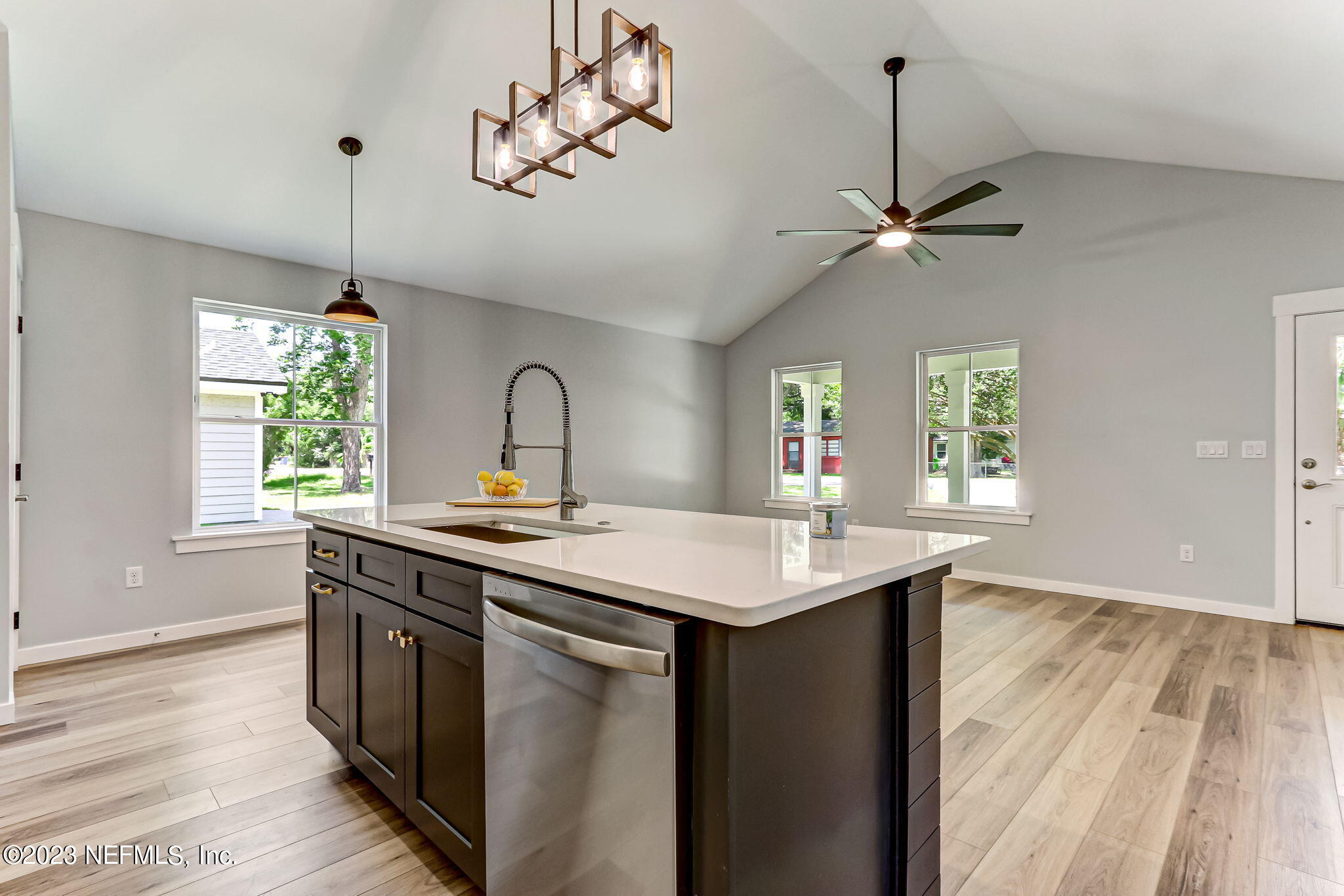 45115 South Mickler Street Callahan, FL 32011 - Photo 10 of 24 a kitchen with a sink a window and wooden floor