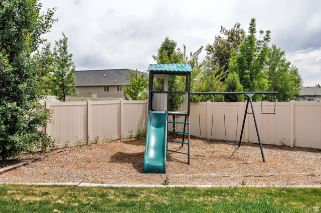 2912 South 1080th Street West Logan, UT 84321 - Photo 37 of 43 Fenced backyard featuring wood chip ground cover and mature trees