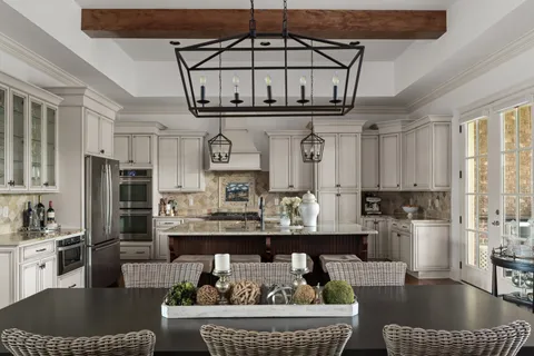 a kitchen with stainless steel appliances granite countertop a stove a refrigerator and a refrigerator