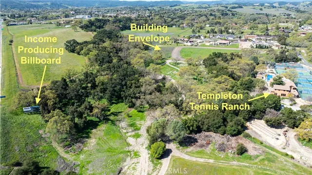 an aerial view of residential houses and outdoor space
