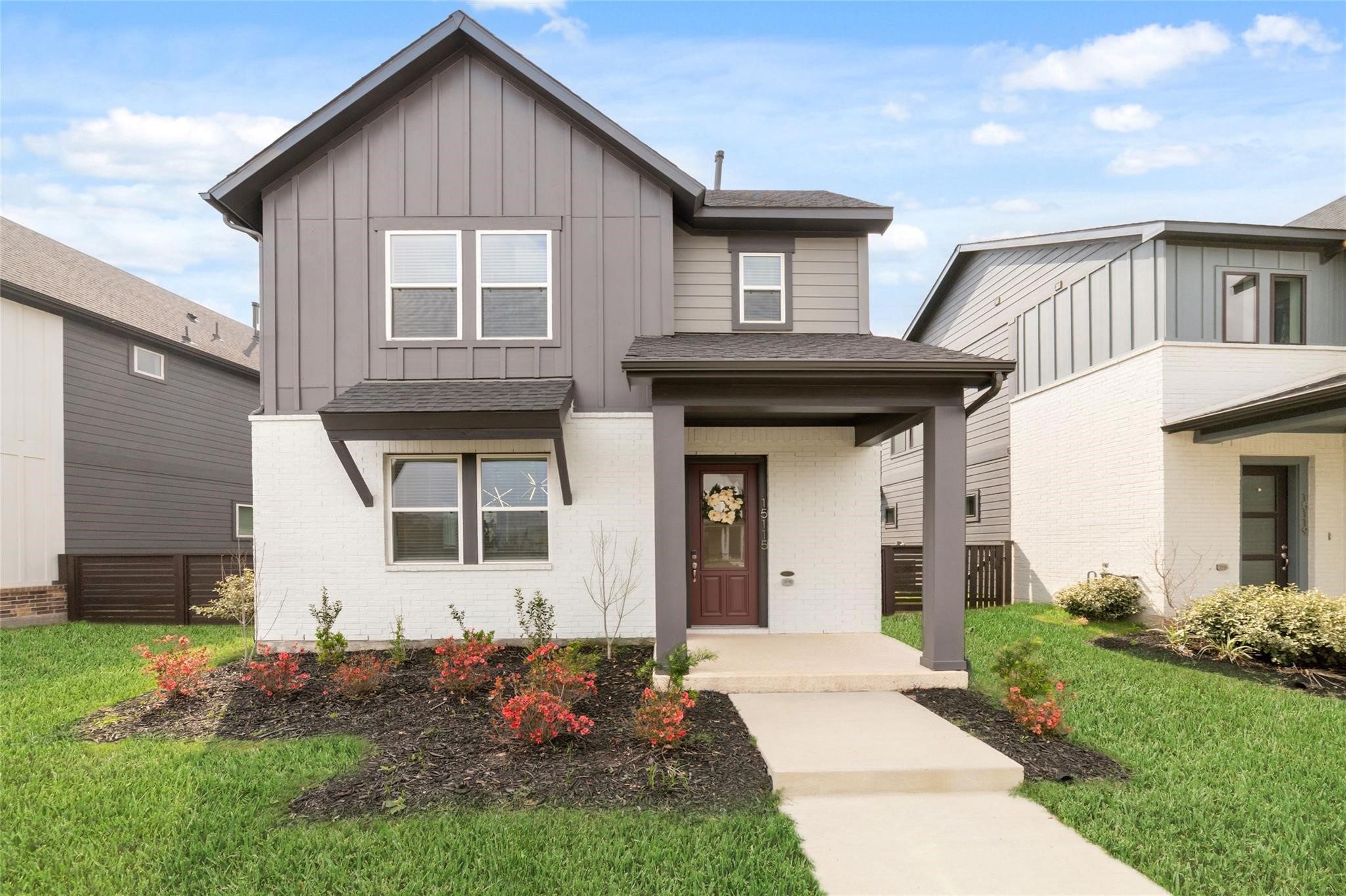 a front view of a house with a yard
