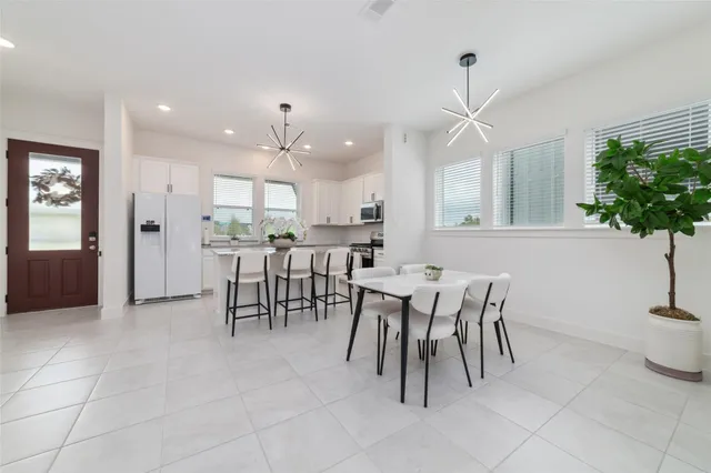 a kitchen with a table and chairs in it