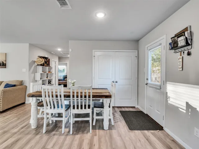 a kitchen with stainless steel appliances granite countertop a refrigerator sink and stove