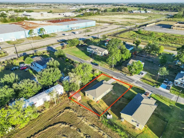 a view of house with yard and green space
