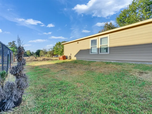 an aerial view of residential house with outdoor space and lake view