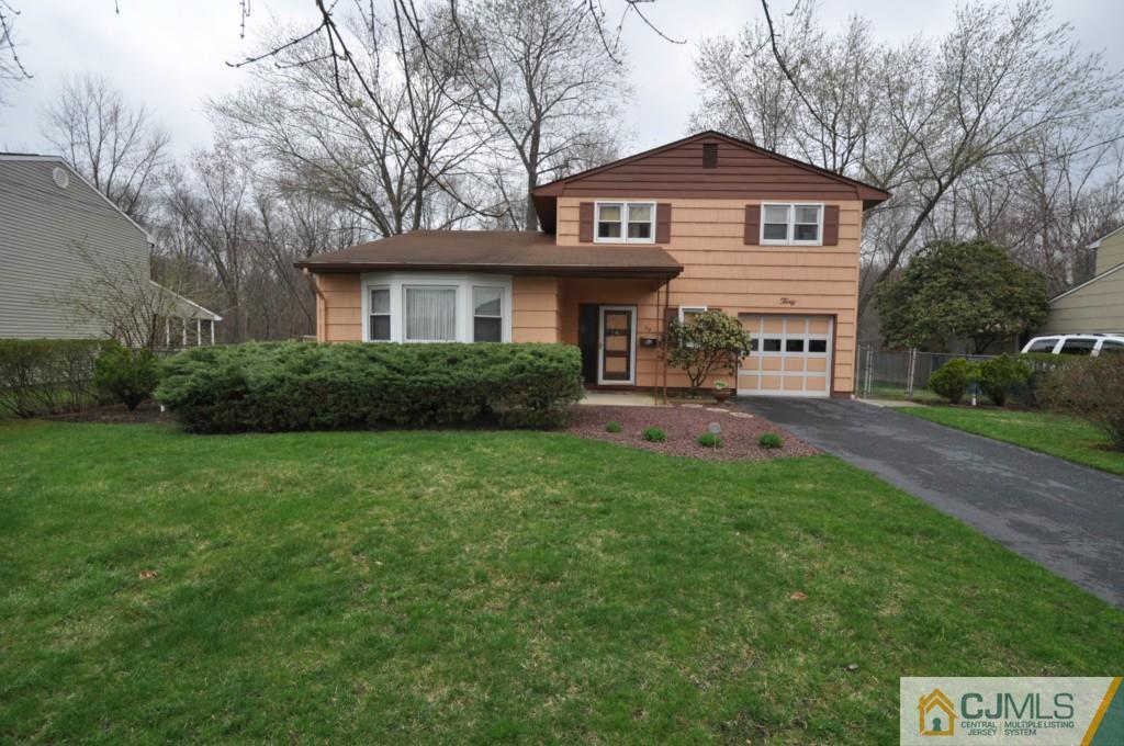 30 Dumas Road Old Bridge, NJ 08857 - Photo 1 of 8 a front view of a house with a yard and trees