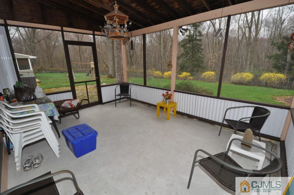30 Dumas Road Old Bridge, NJ 08857 - Photo 4 of 8 a view of a chairs and table in patio with a backyard