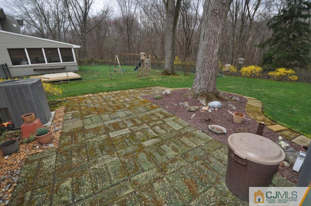 30 Dumas Road Old Bridge, NJ 08857 - Photo 5 of 8 a view of a porch with furniture and garden