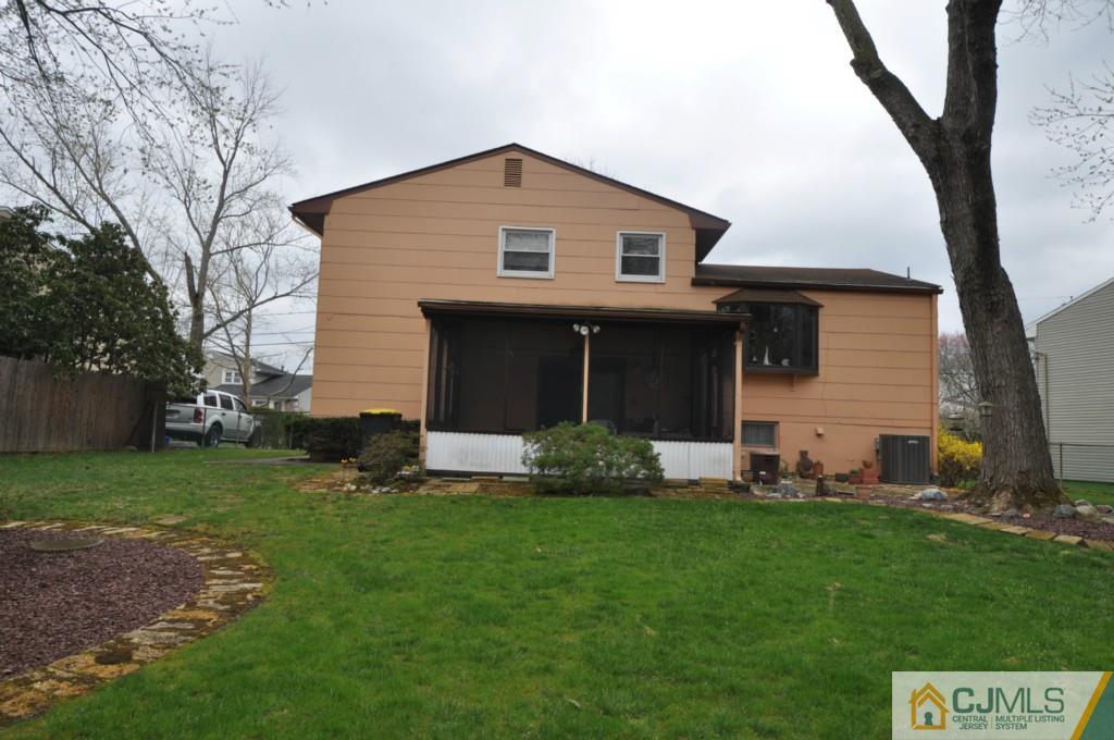 30 Dumas Road Old Bridge, NJ 08857 - Photo 7 of 8 a front view of a house with a yard and tree