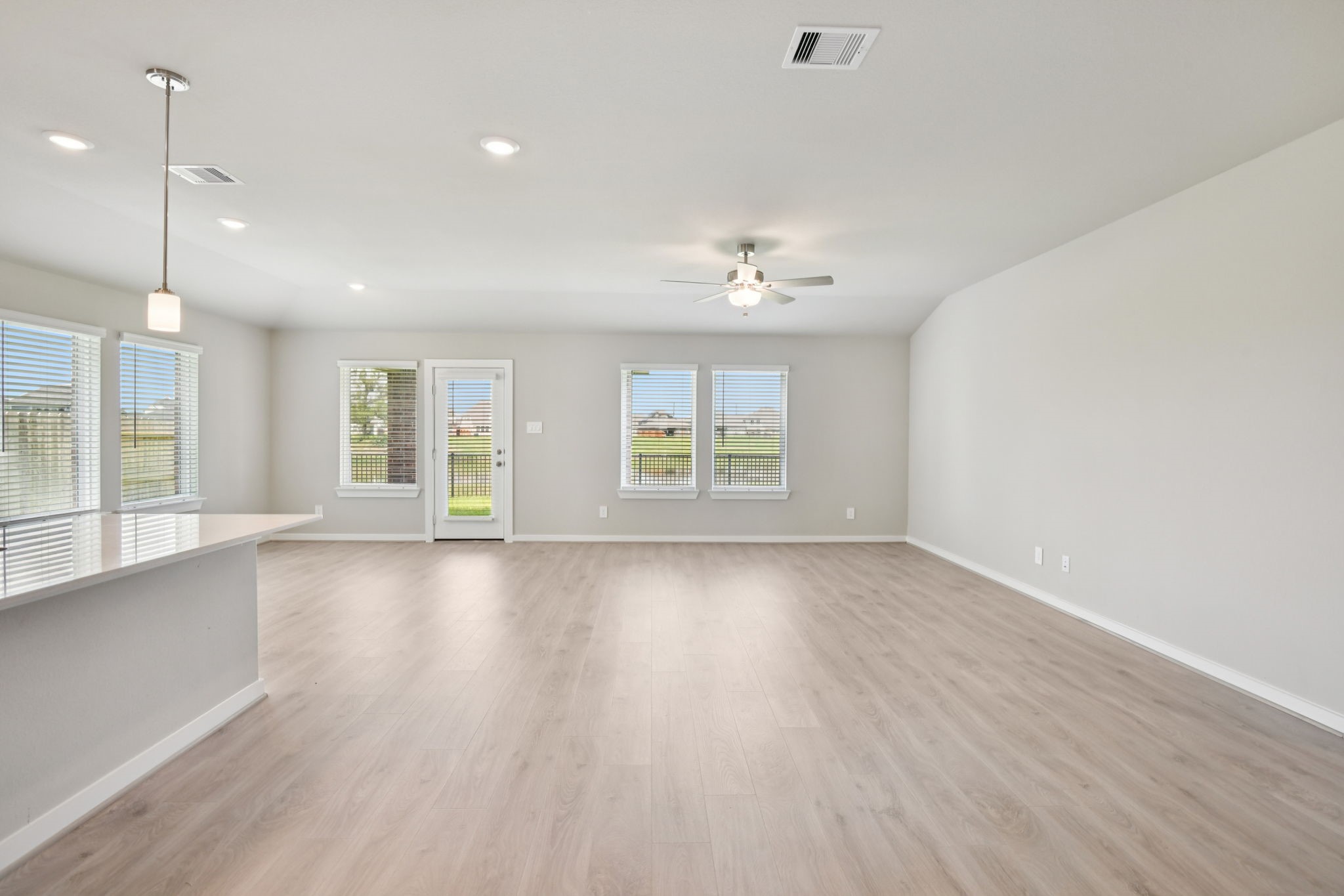 5814 Chamberlain Crossing Rosenberg, TX 77471 - Photo 14 of 39 a view of an empty room with a window and wooden floor