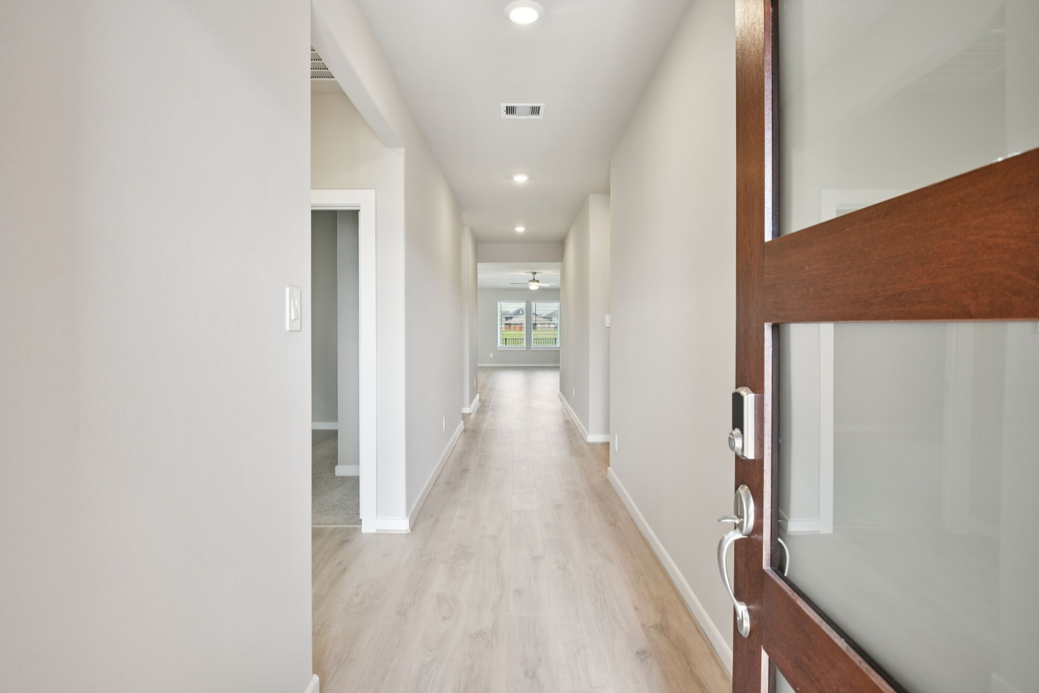 5814 Chamberlain Crossing Rosenberg, TX 77471 - Photo 2 of 39 a view of hallway with wooden floor