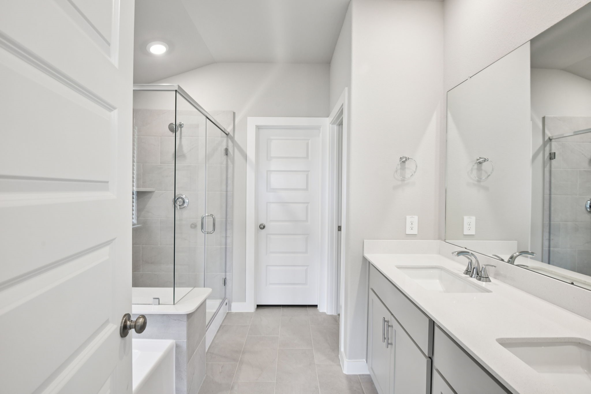 5814 Chamberlain Crossing Rosenberg, TX 77471 - Photo 23 of 39 a bathroom with a double vanity sink toilet mirror and shower