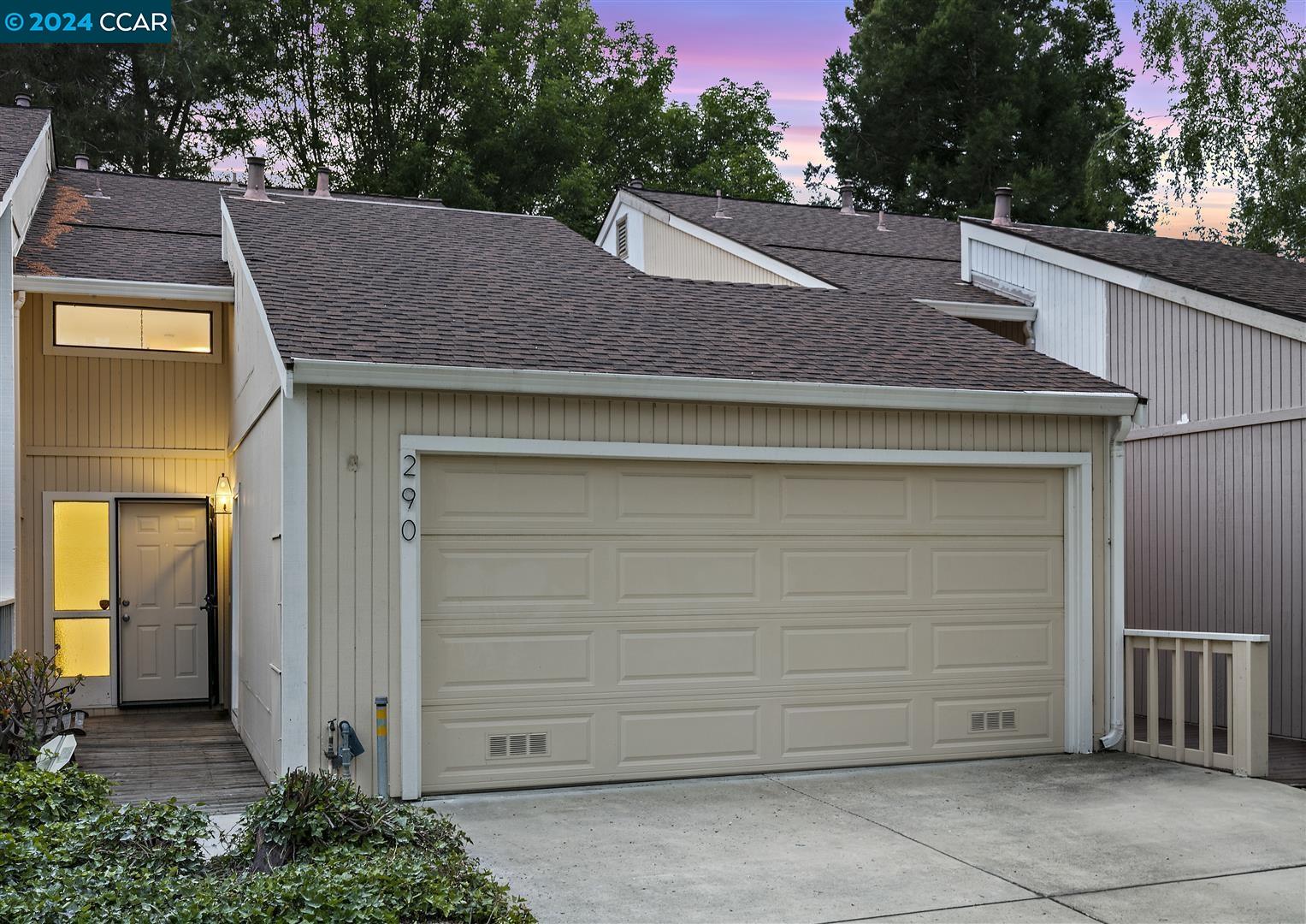 a view of a house with a garage
