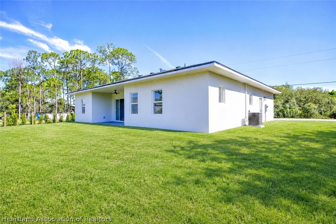 4307 Talbot Street Sebring, FL 33872 - Photo 18 of 19 a front view of house with garden